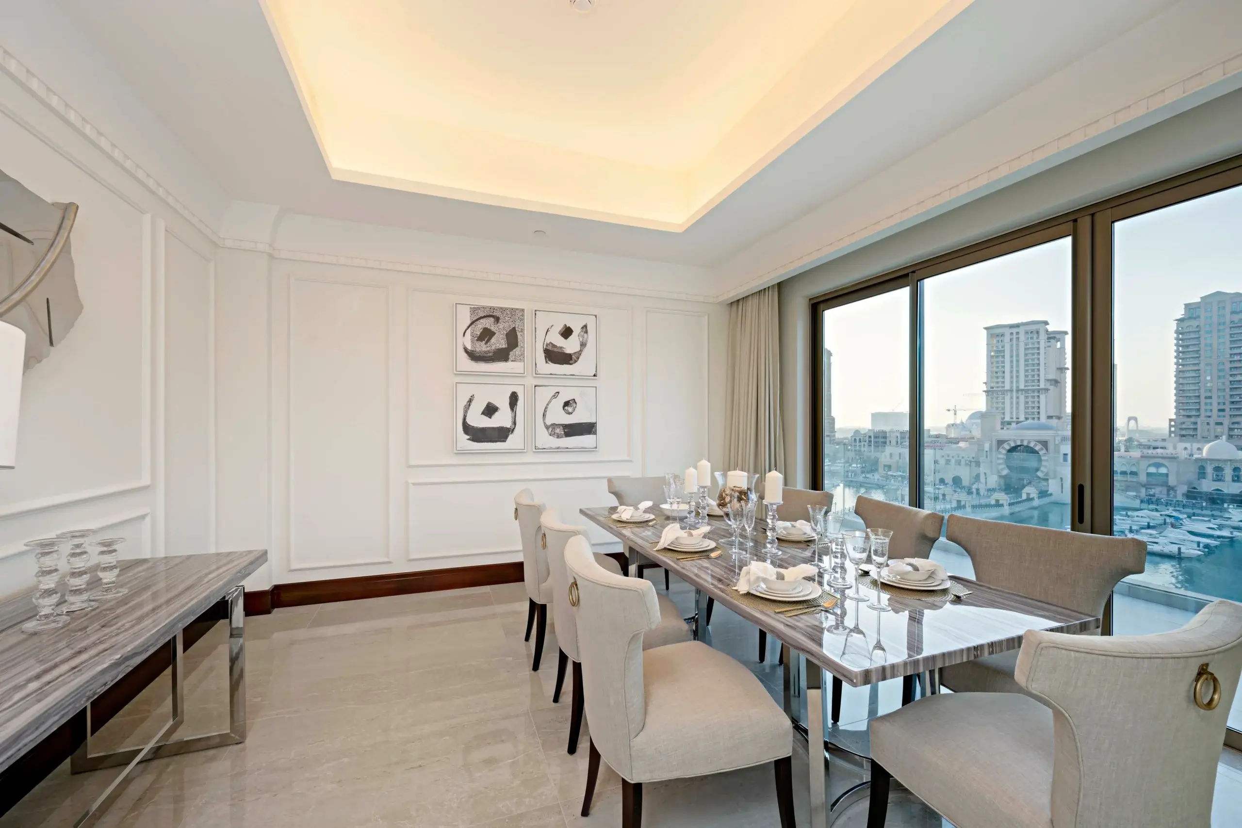 A formal dining room with a marina view.