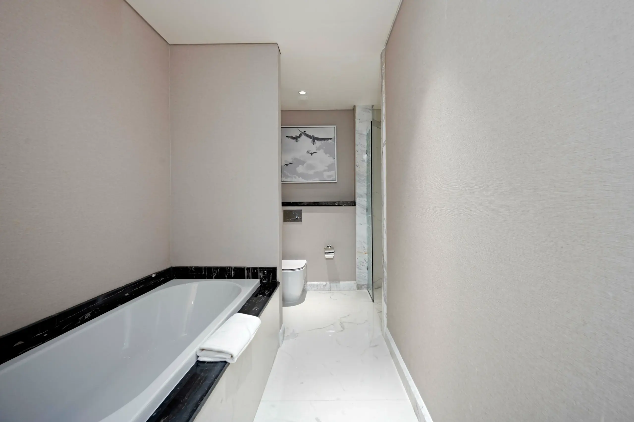 A modern bathroom with a tub and shower.