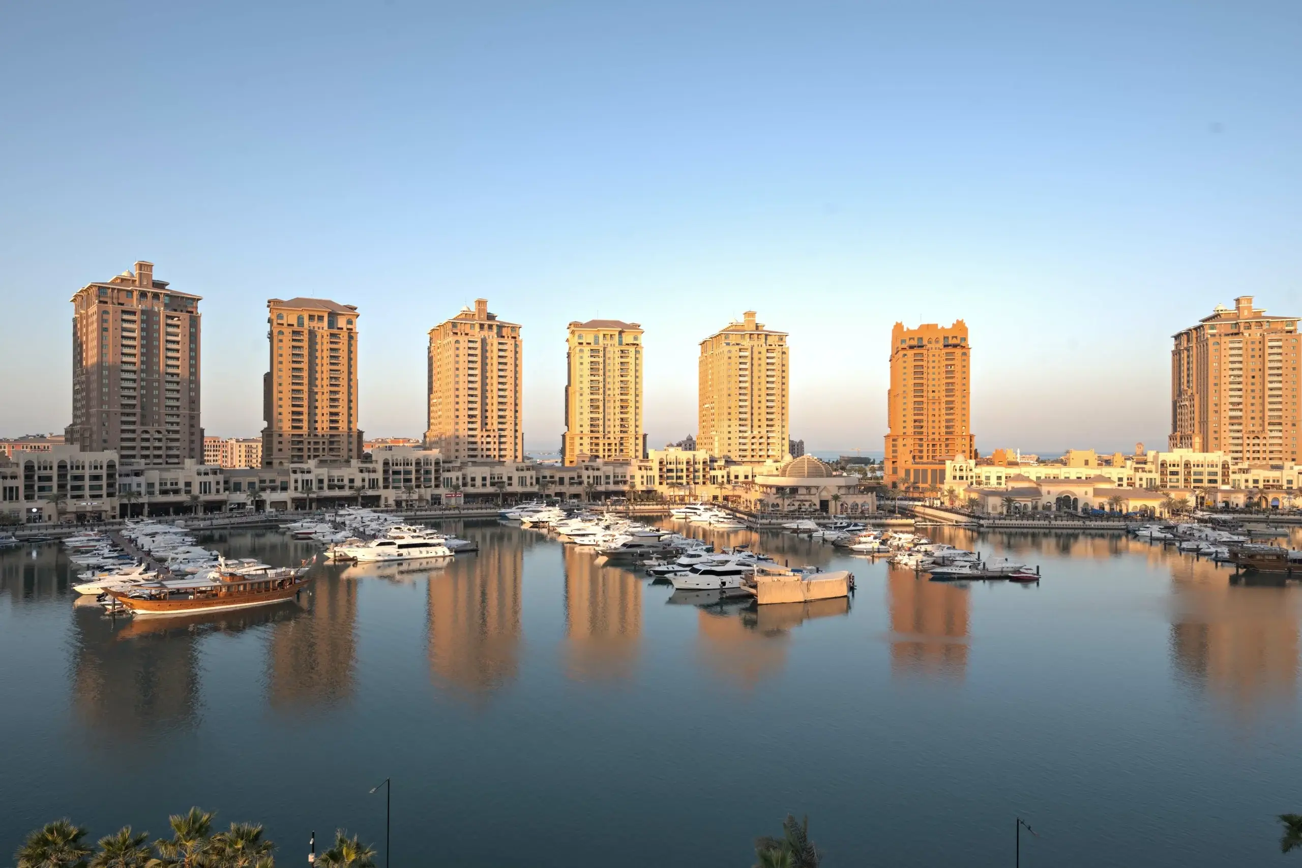 A waterfront with buildings and boats.