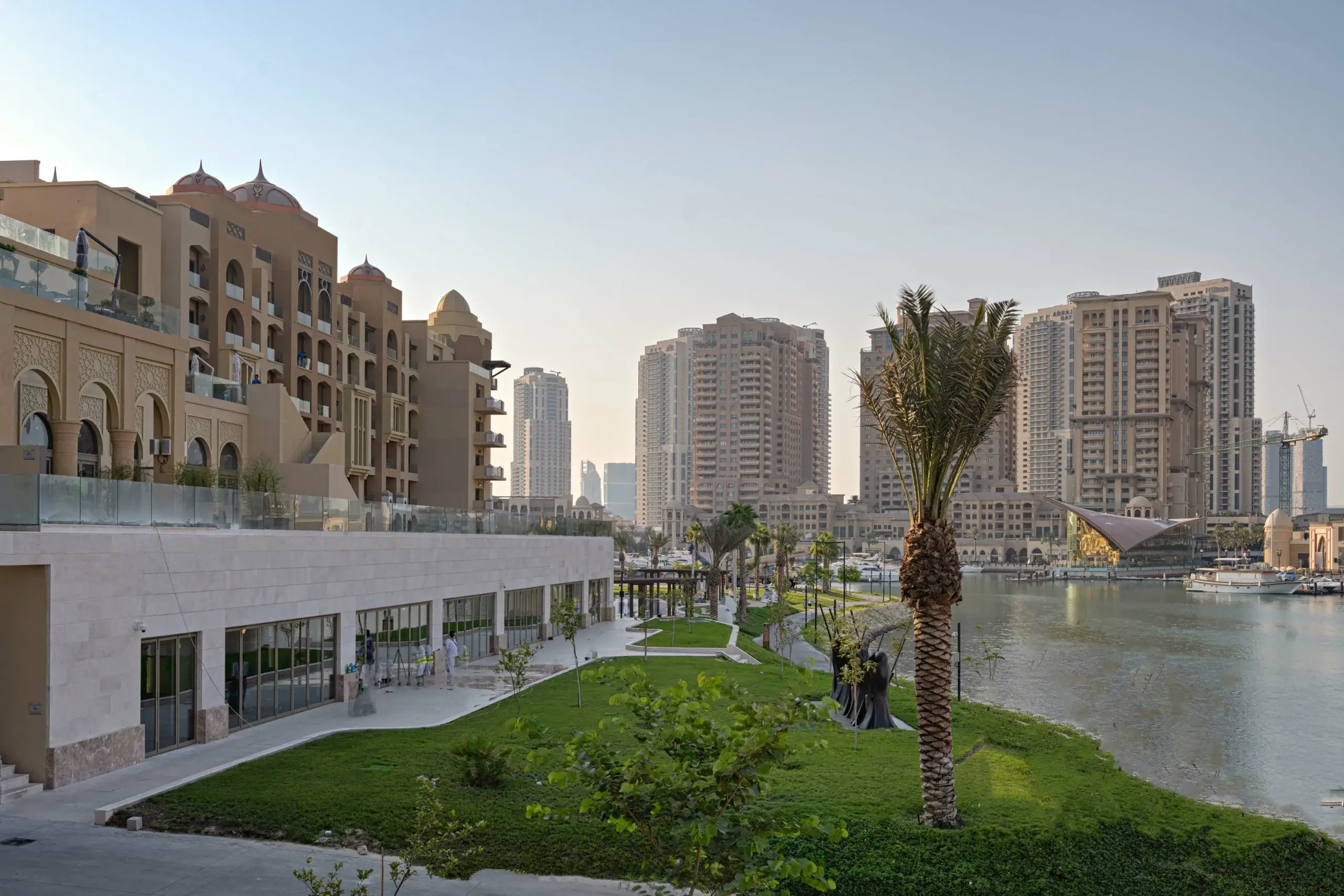 A modern city with buildings and a waterfront.
