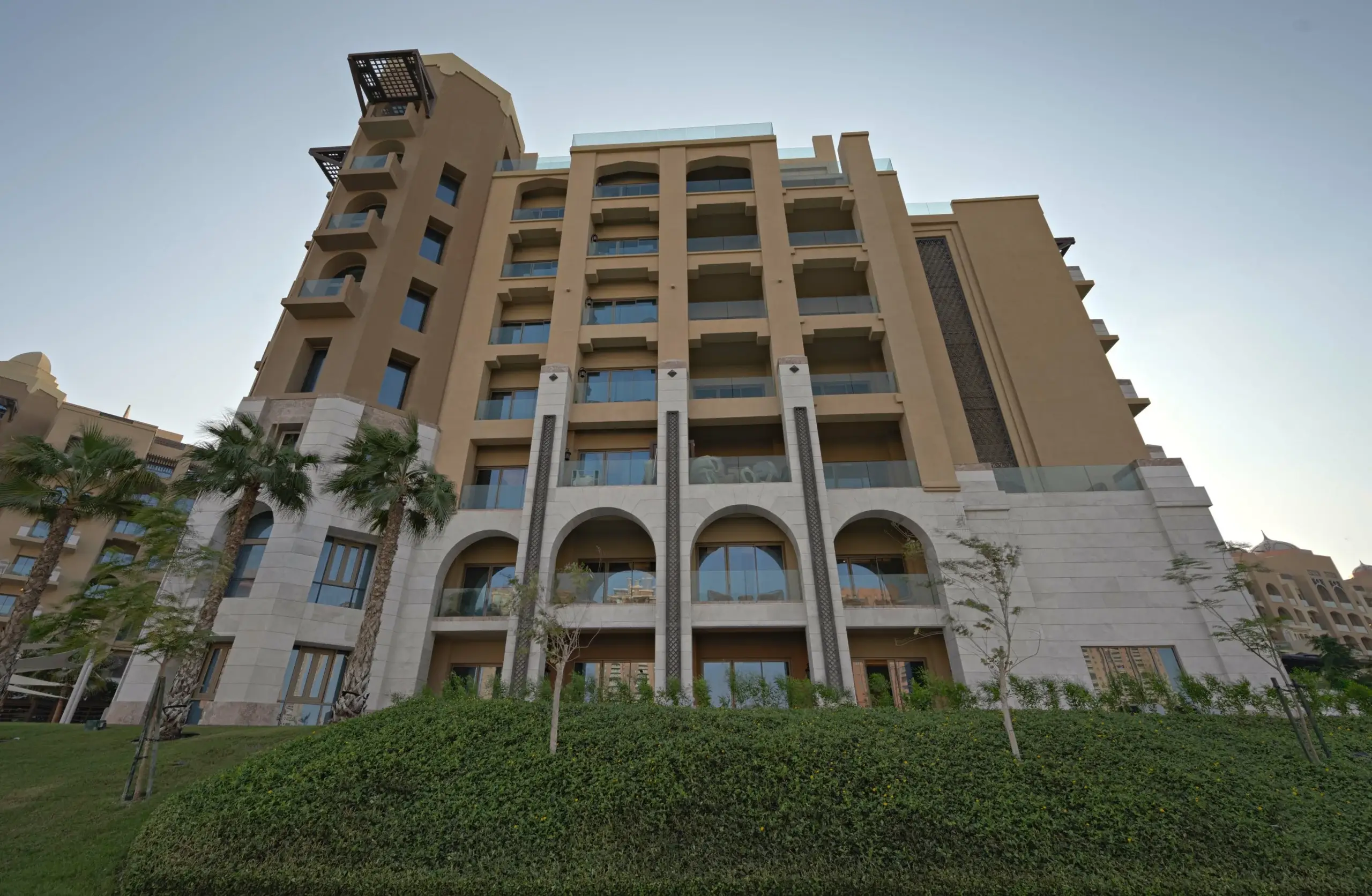 building with balconies and arched windows