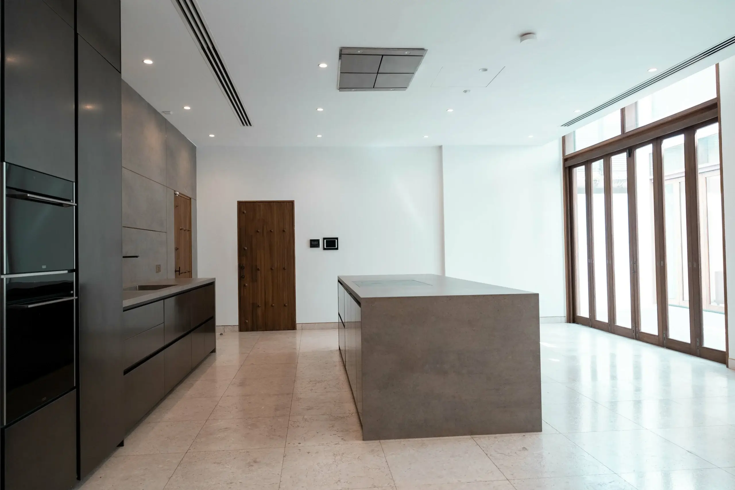 A dining room with a table set for a meal