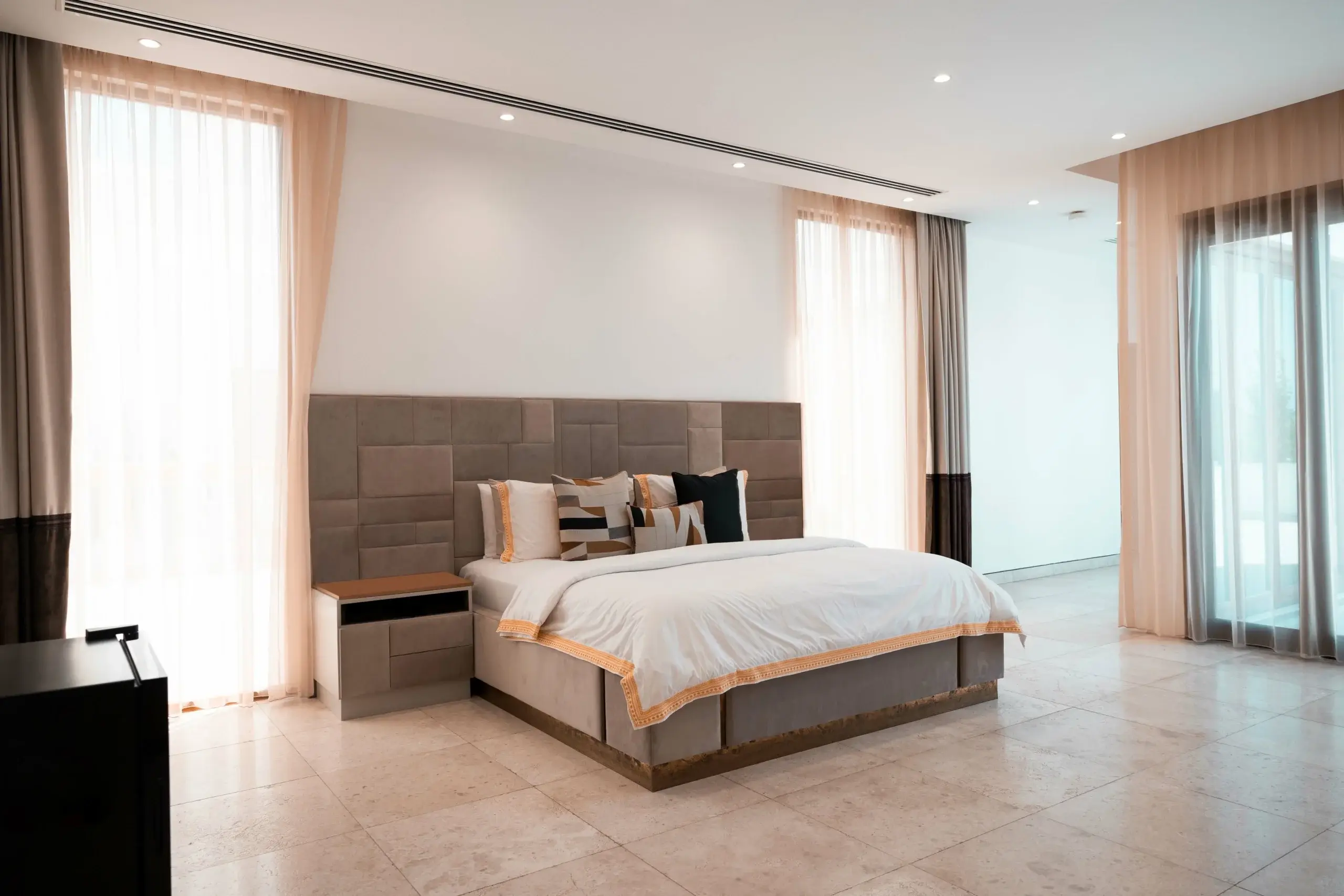 A spacious bedroom with a large bed