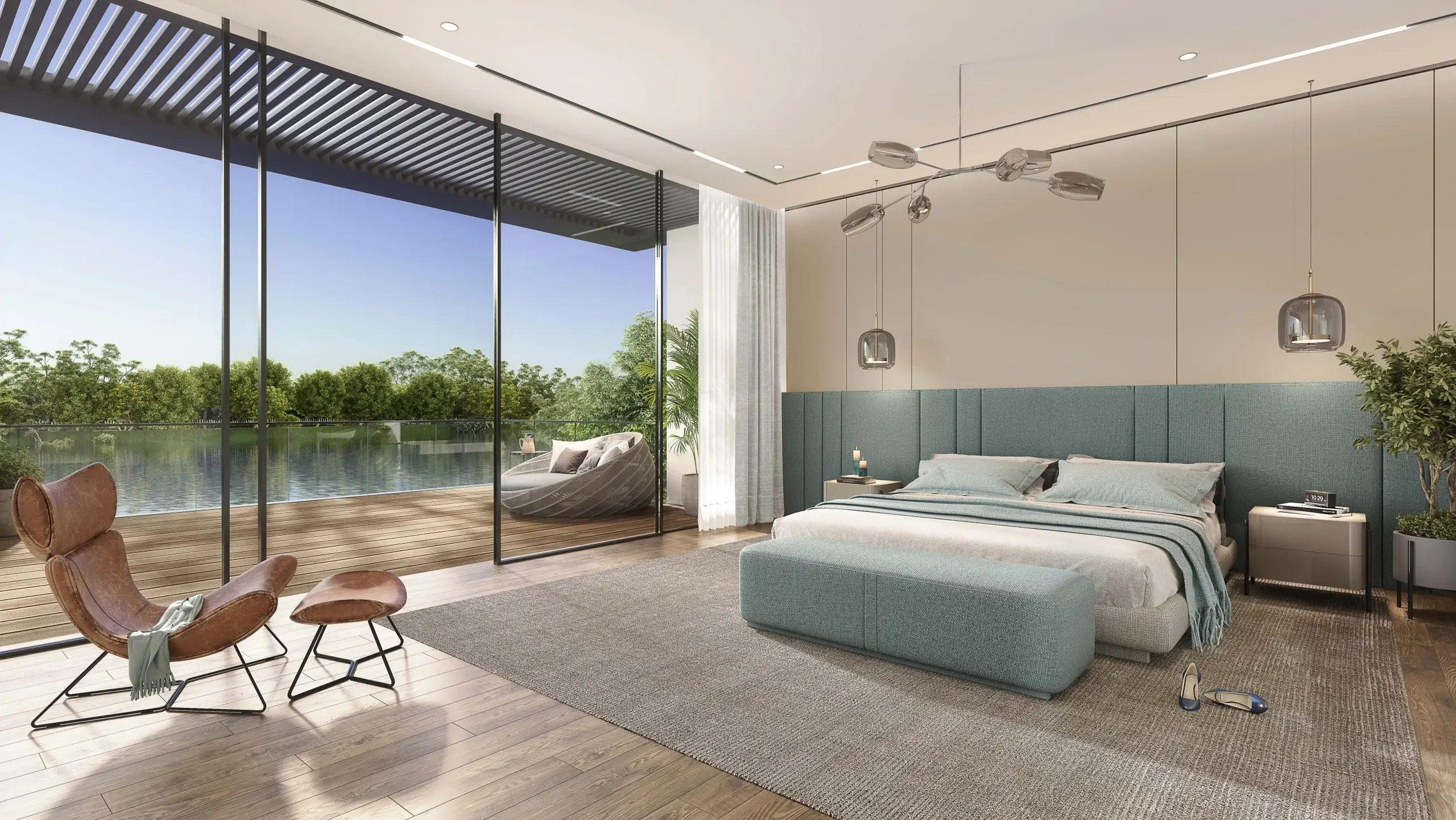 A bedroom with a bed and a view of a lake.