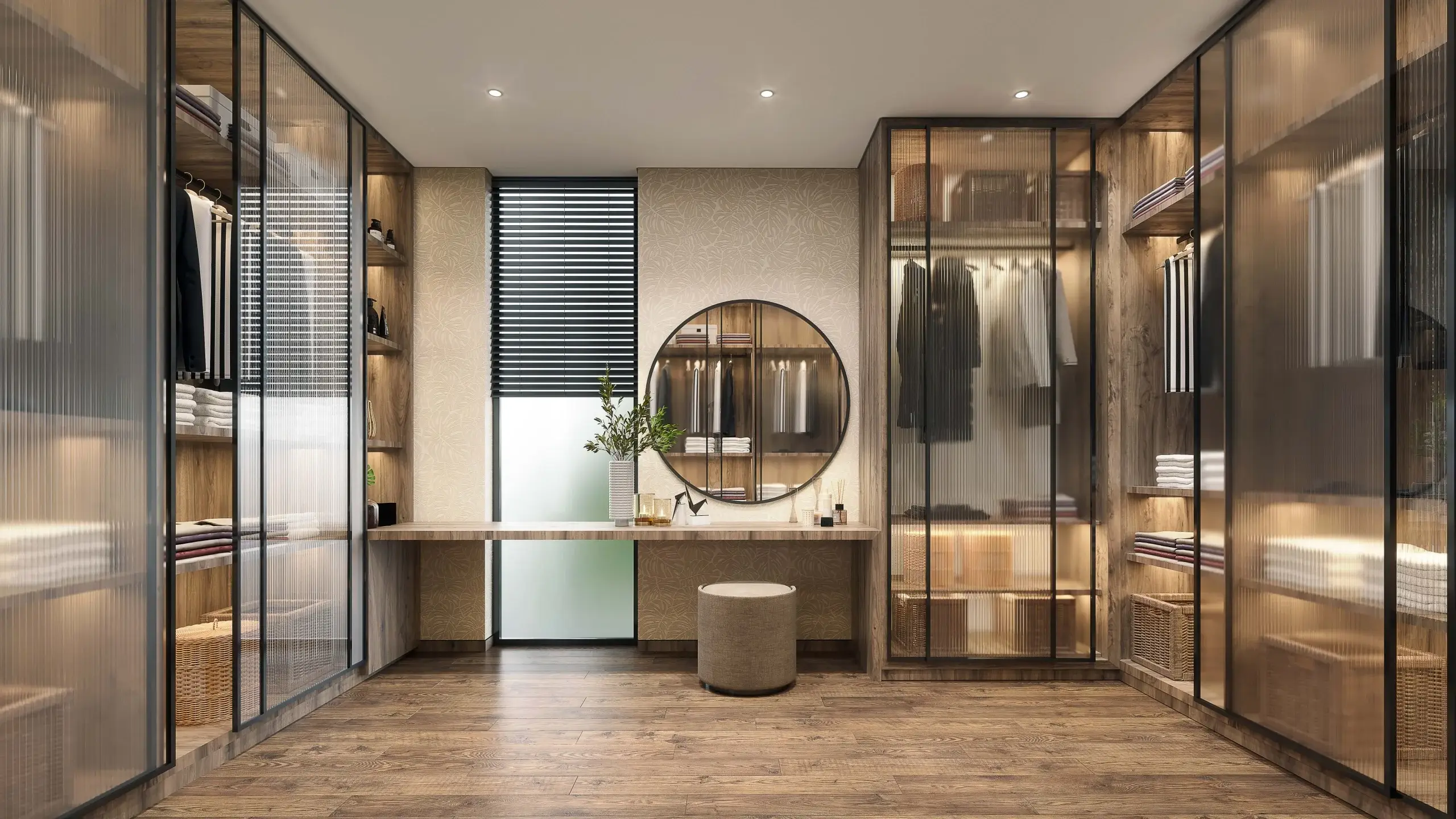 A stylish walk-in closet with glass doors.
