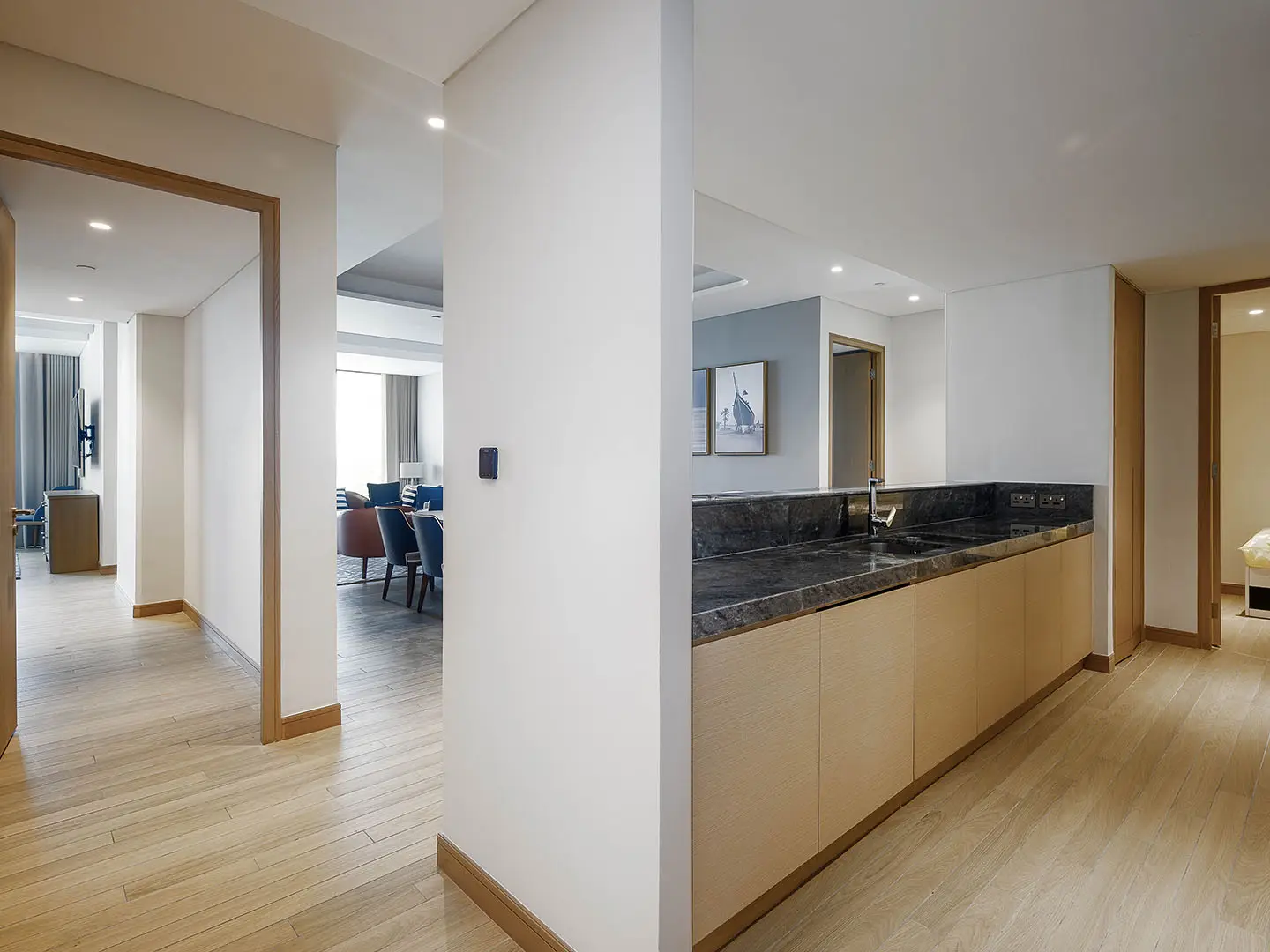 A modern interior hallway with wood flooring