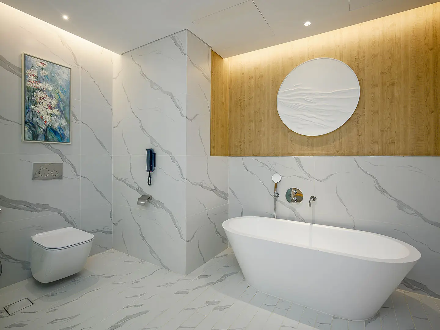 A spacious bathroom with a modern bathtub