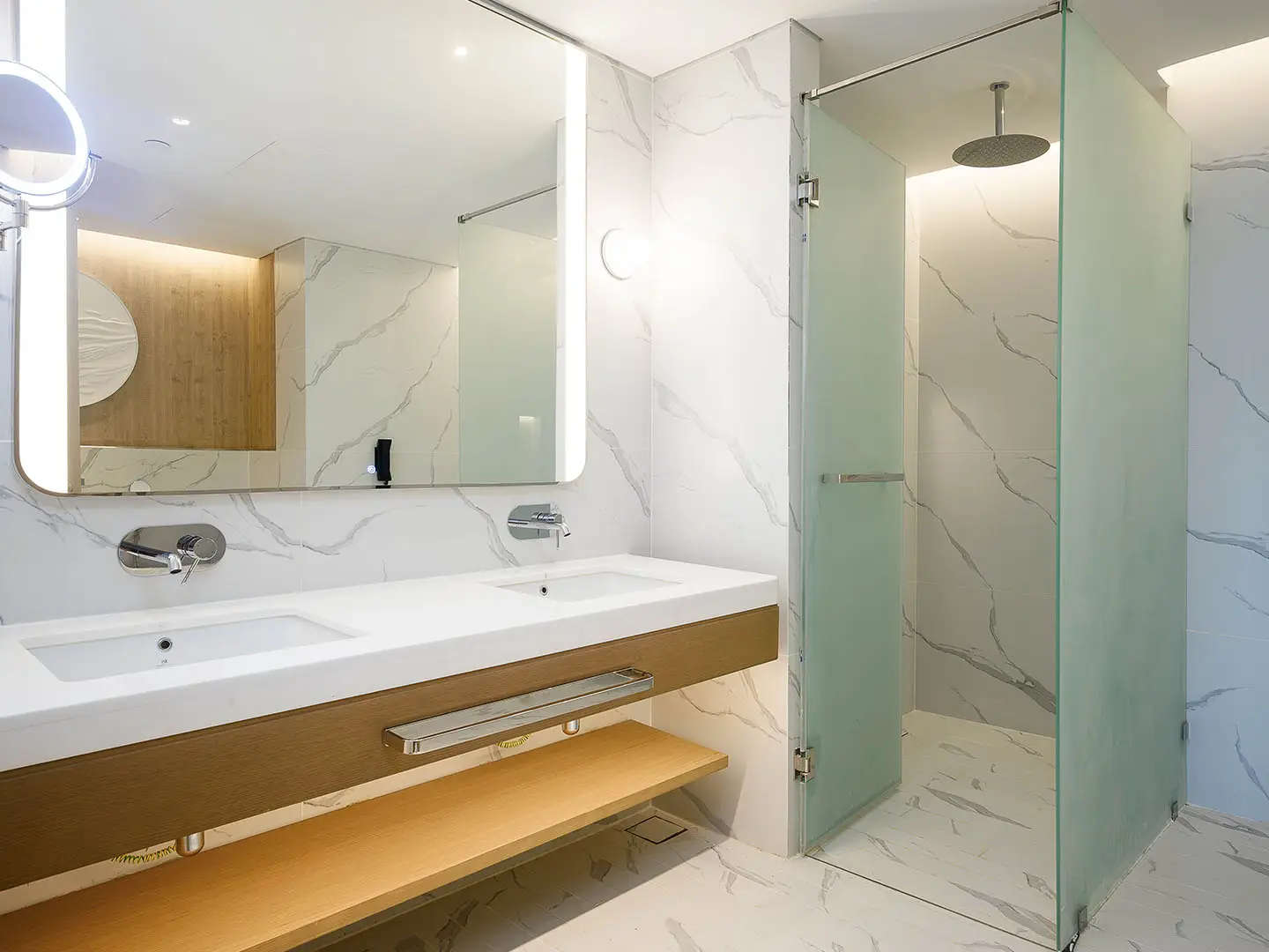 Bathroom with a double sink and shower