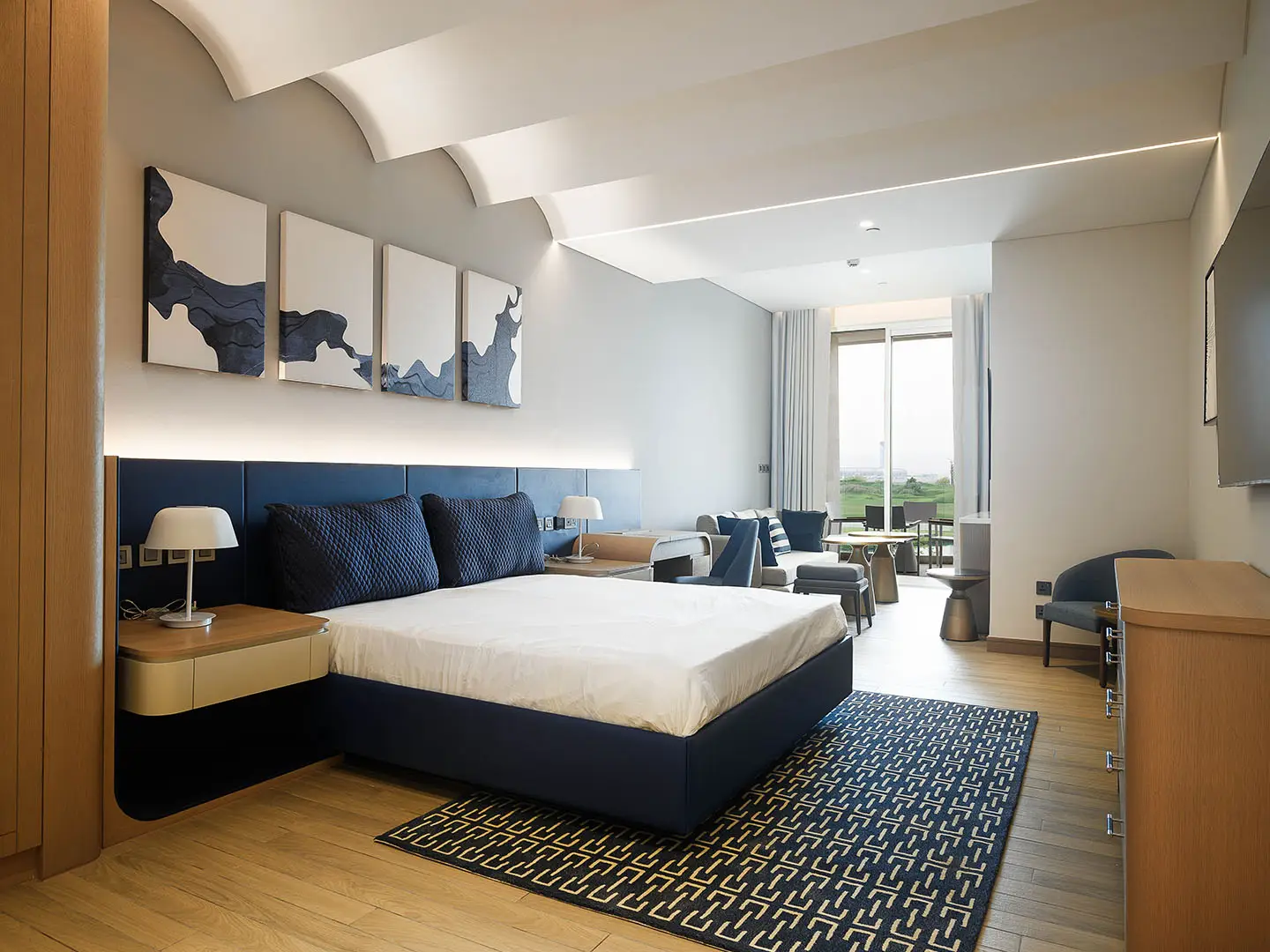 A contemporary bedroom with blue accents