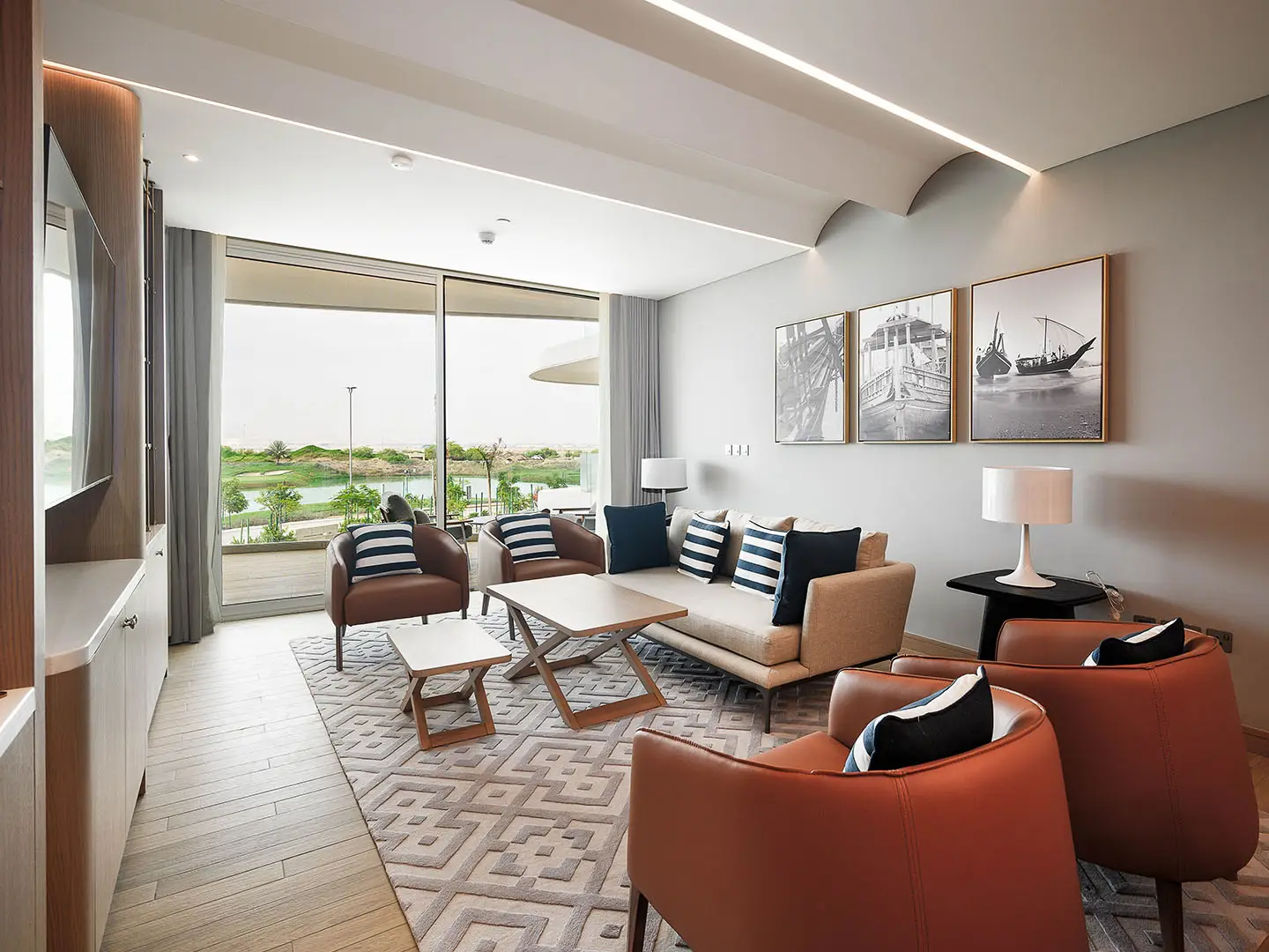 A living room with art and a golf view