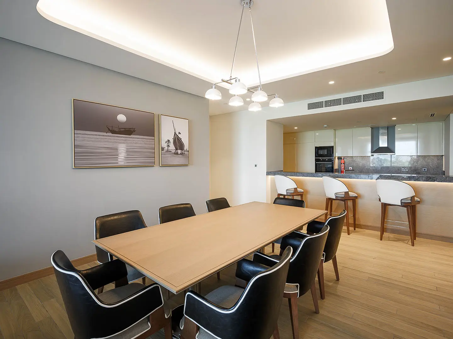 A spacious dining area with a modern kitchen