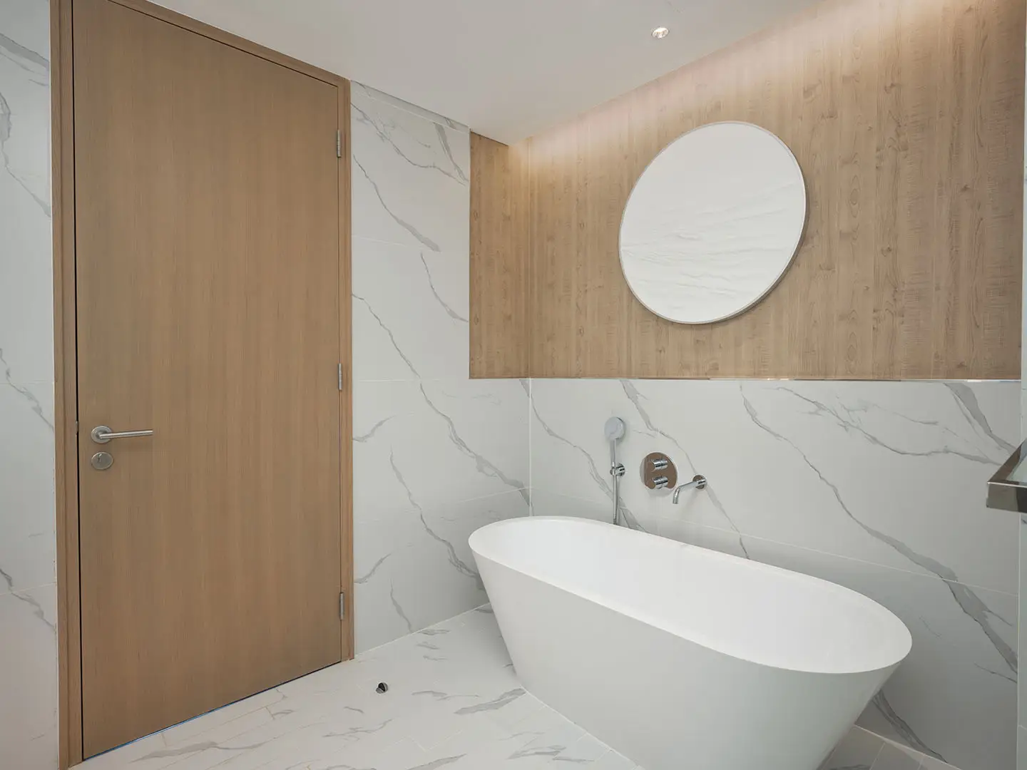 A modern bathroom with a freestanding tub.