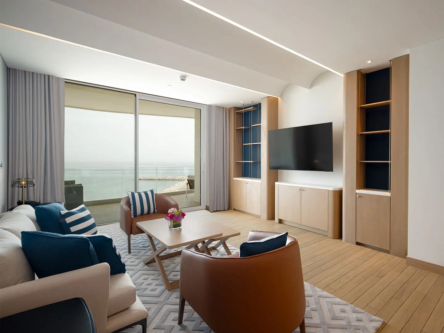 Living room with sea view and artistic decor.