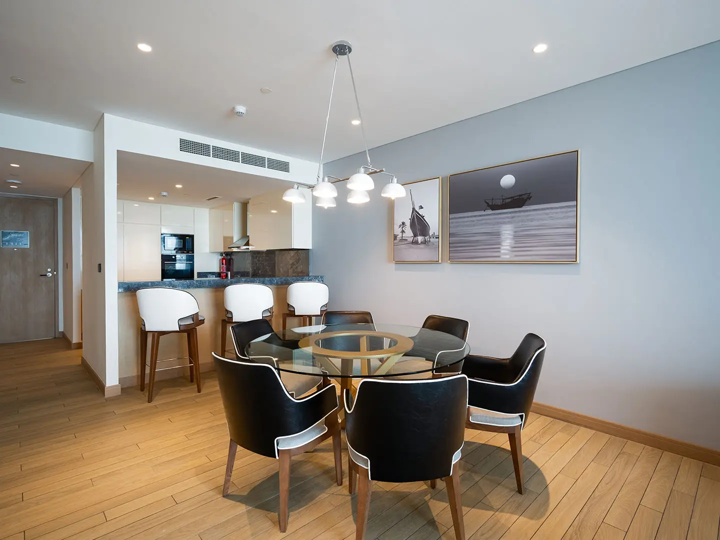 Dining room with round table and chairs.
