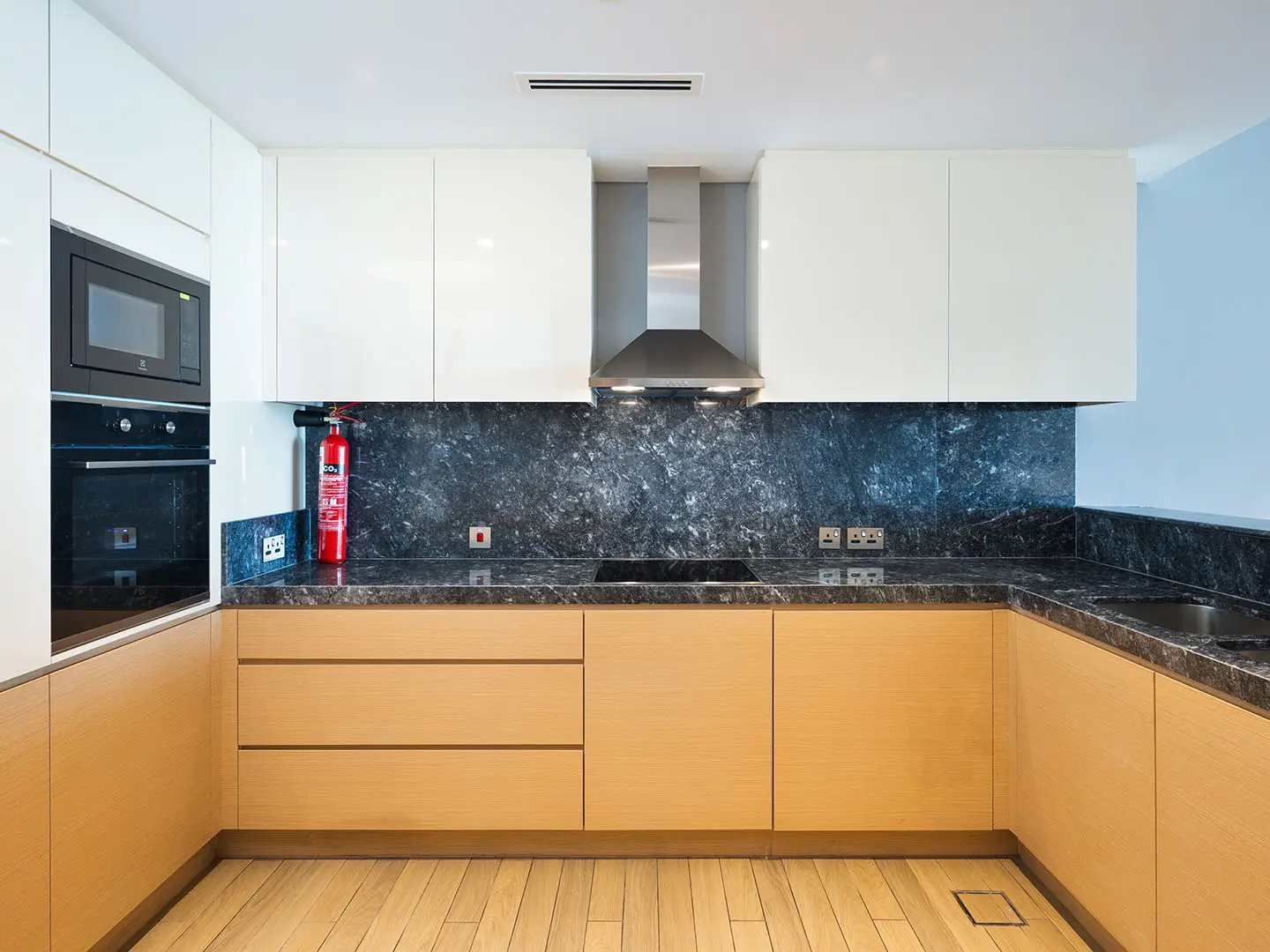 A modern kitchen with white cabinets