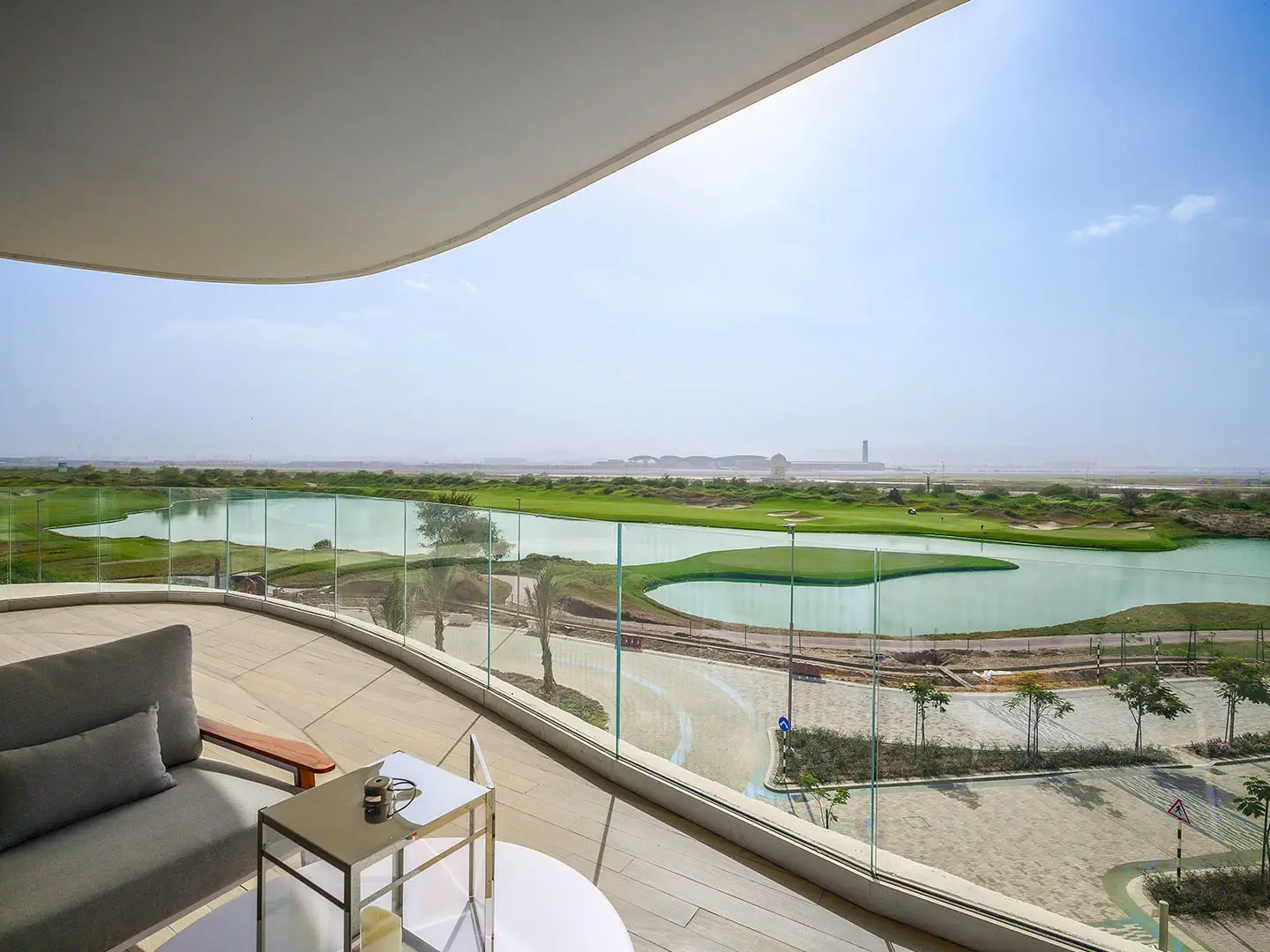 Outdoor patio: golf course and lake views.