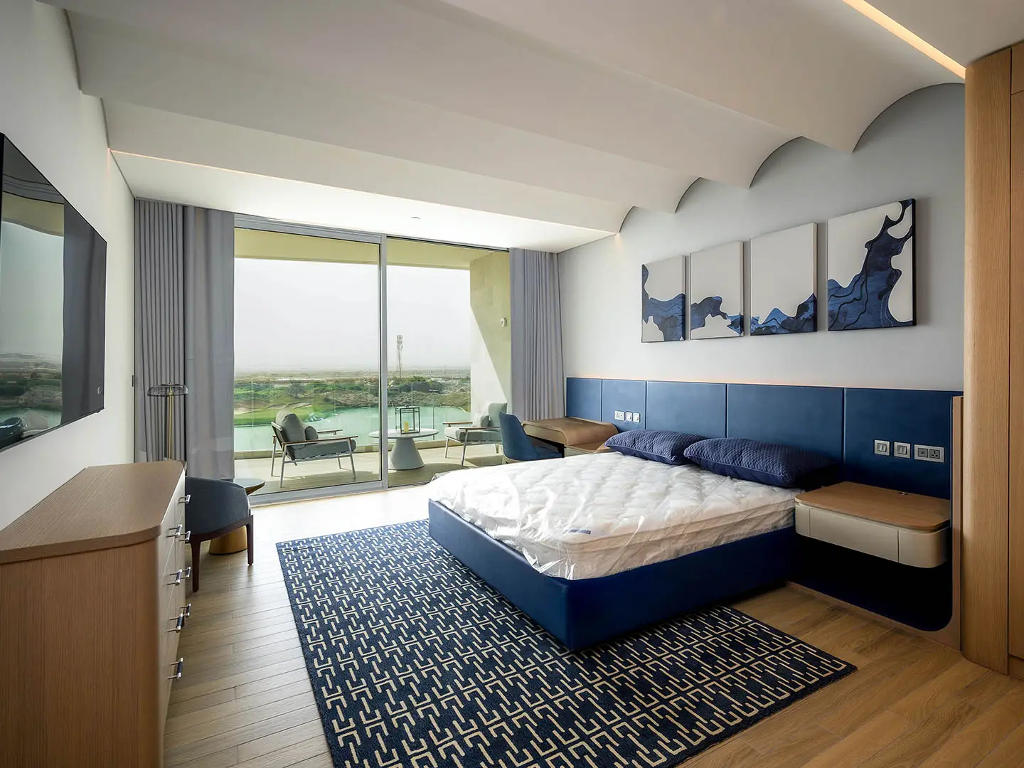 Modern bedroom with golf course view.