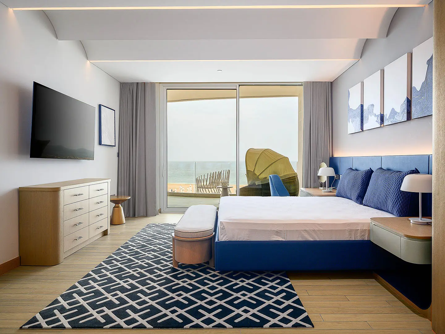 A bedroom with a bed and sea view