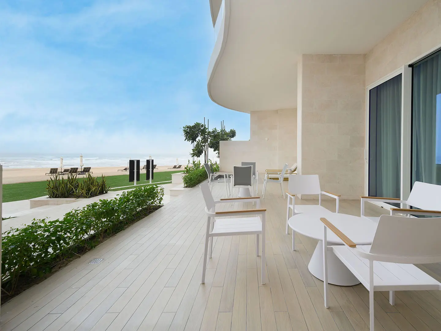 Modern villa entrance with elegant green landscape