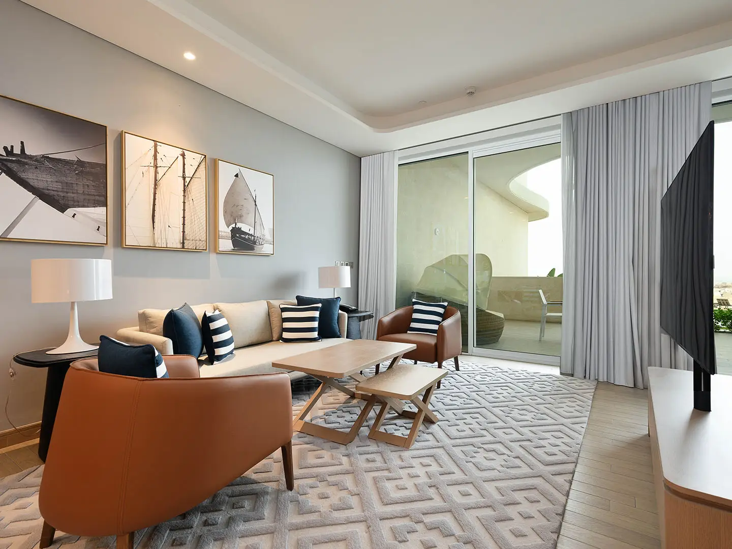 Seating with dining and balcony view