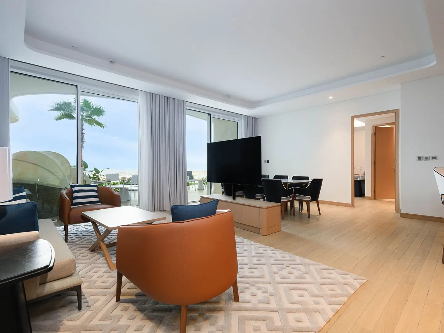 Dining area beside open kitchen with natural light