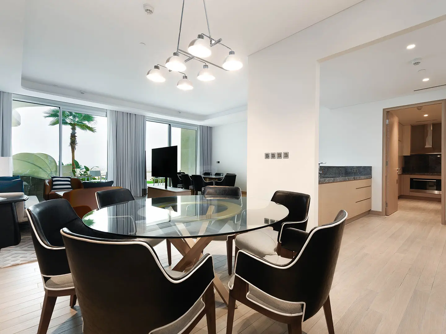 Living area with open kitchen, dining, and seating