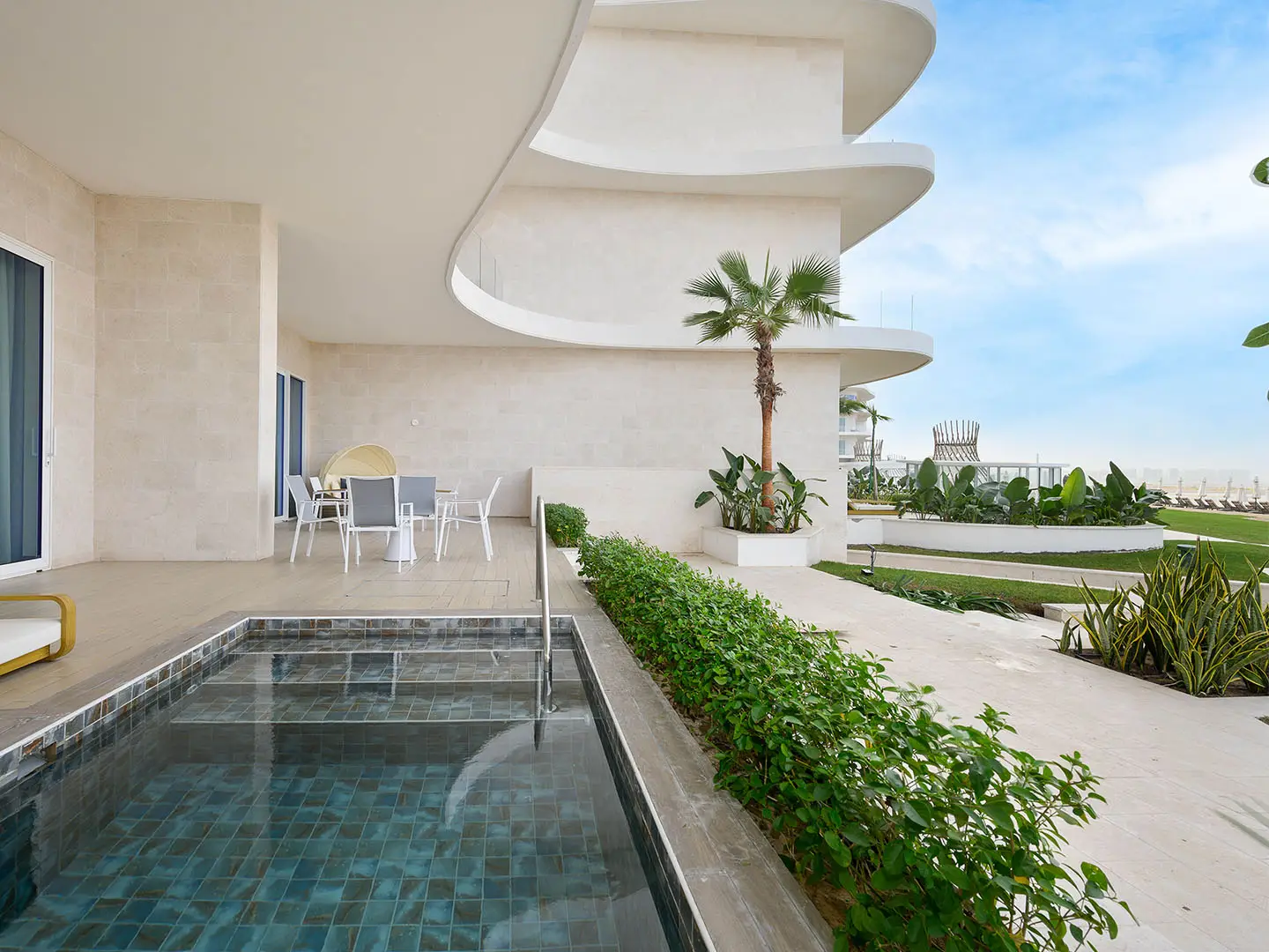 ALMOUJ_D10_4BR_WEB_NO_WM_0011_ALMOUJ_D10_4BR_HR-2 A patio with a pool and outdoor dining area