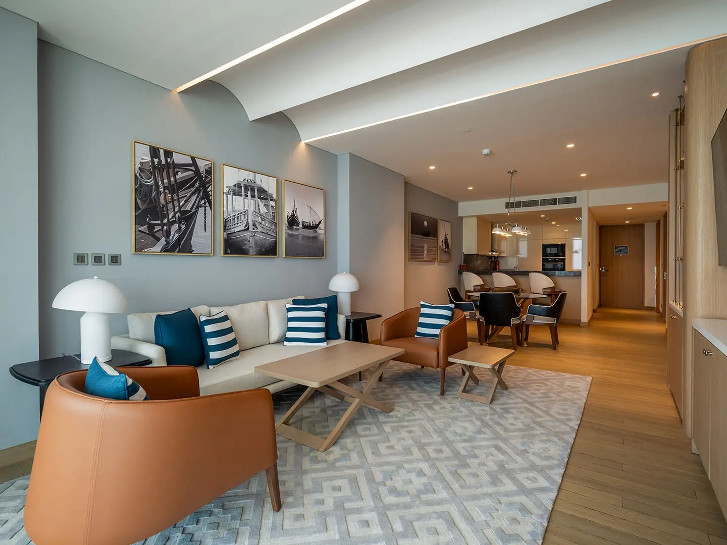 Small dining table next to a modern style kitchen