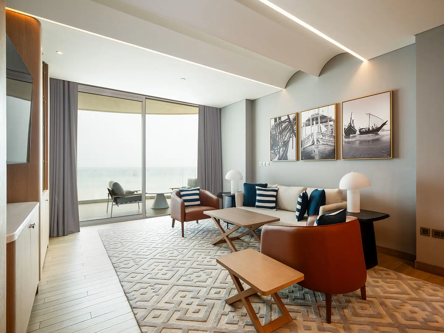 ALMOUJ_217_1BR_WEB_WM_0009_ALMOUJ_217_1BR_HR-4 Modern living room with balcony and outdoor view