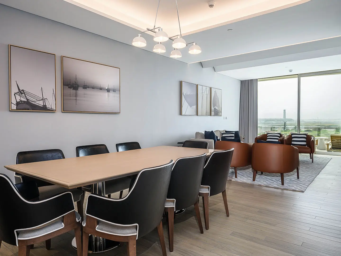 A large dining area and living room with a view
