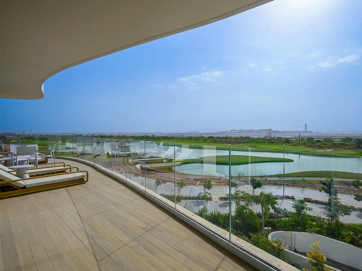 A balcony overlooking a golf course