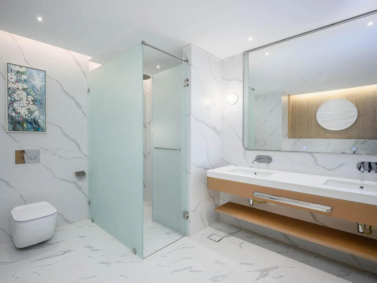 A modern bathroom with a glass shower