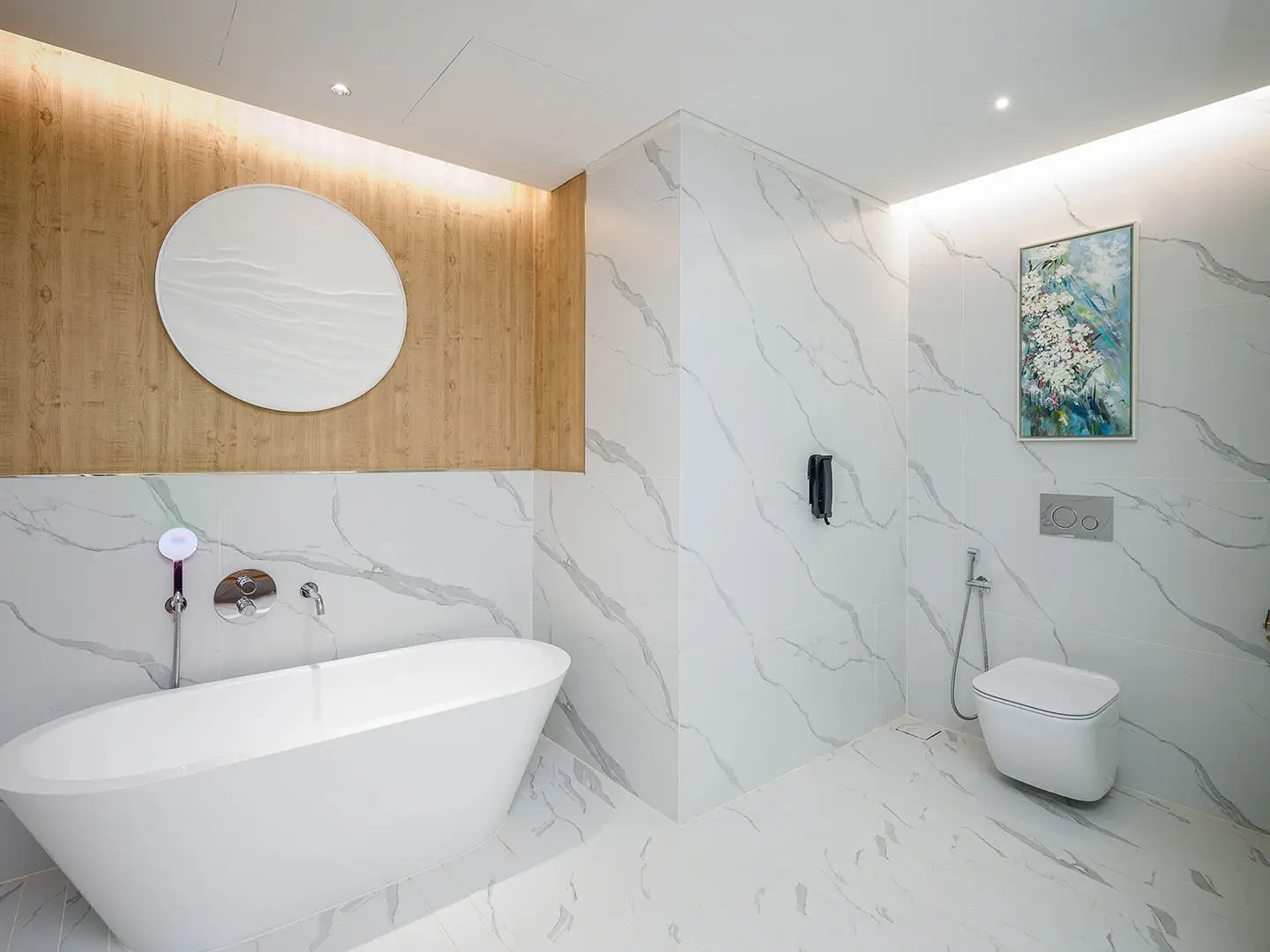 Bathroom with freestanding tub and marble