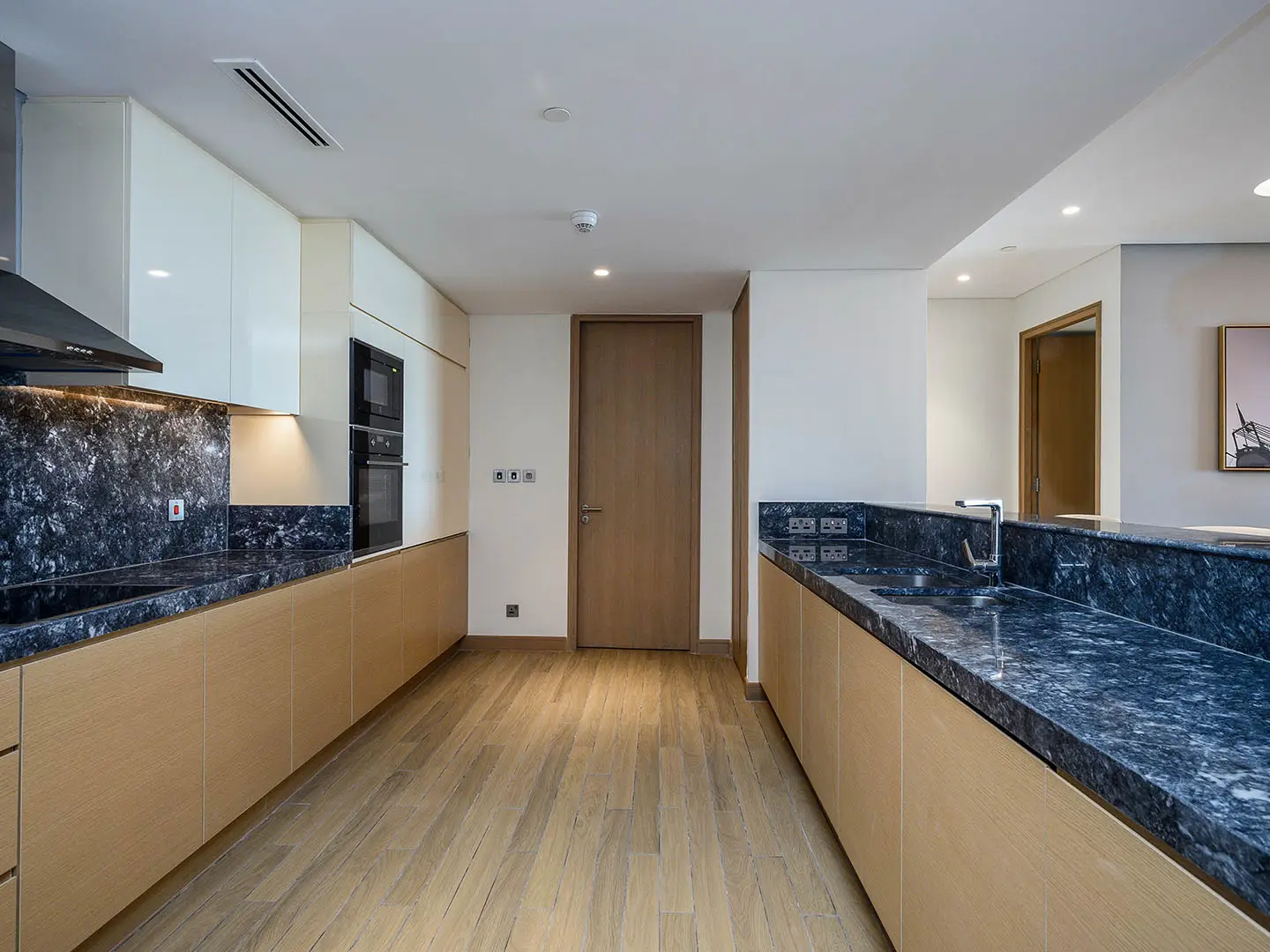 A modern kitchen with dark countertops