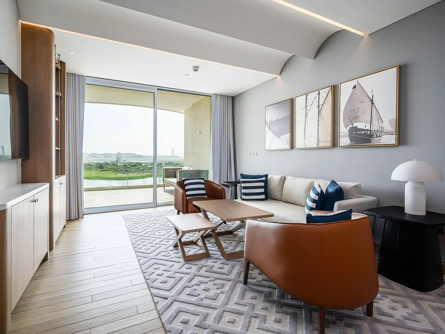 A spacious living room with modern decor and a view