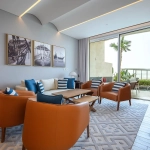 Living room with orange chairs and patio