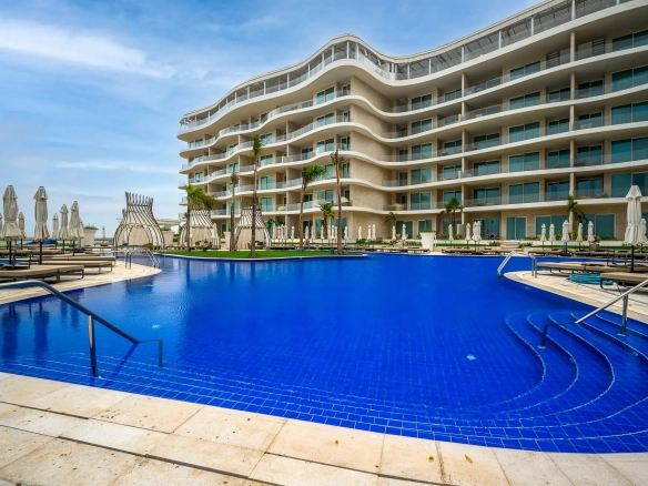 Elegant hotel pool surrounded by modern architecture