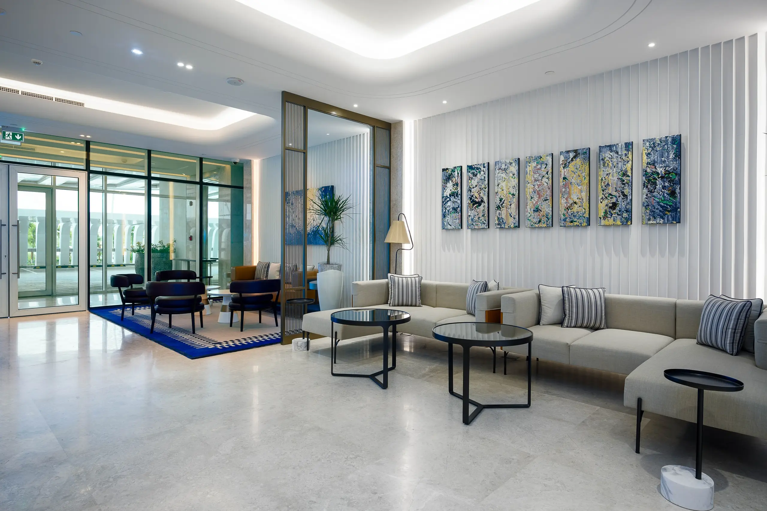 A spacious modern lobby with multiple seating areas