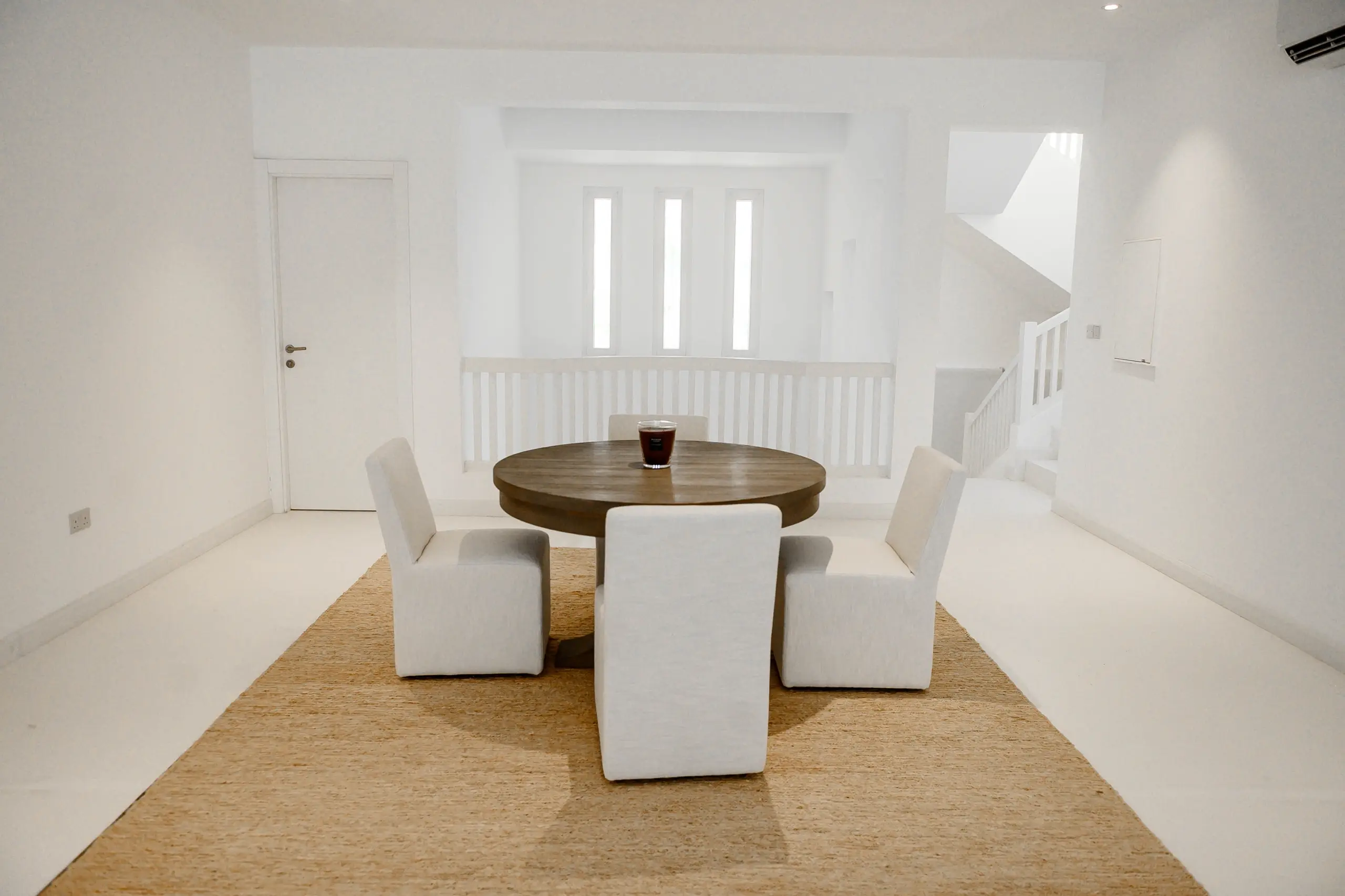 A simple dining area with a round table.