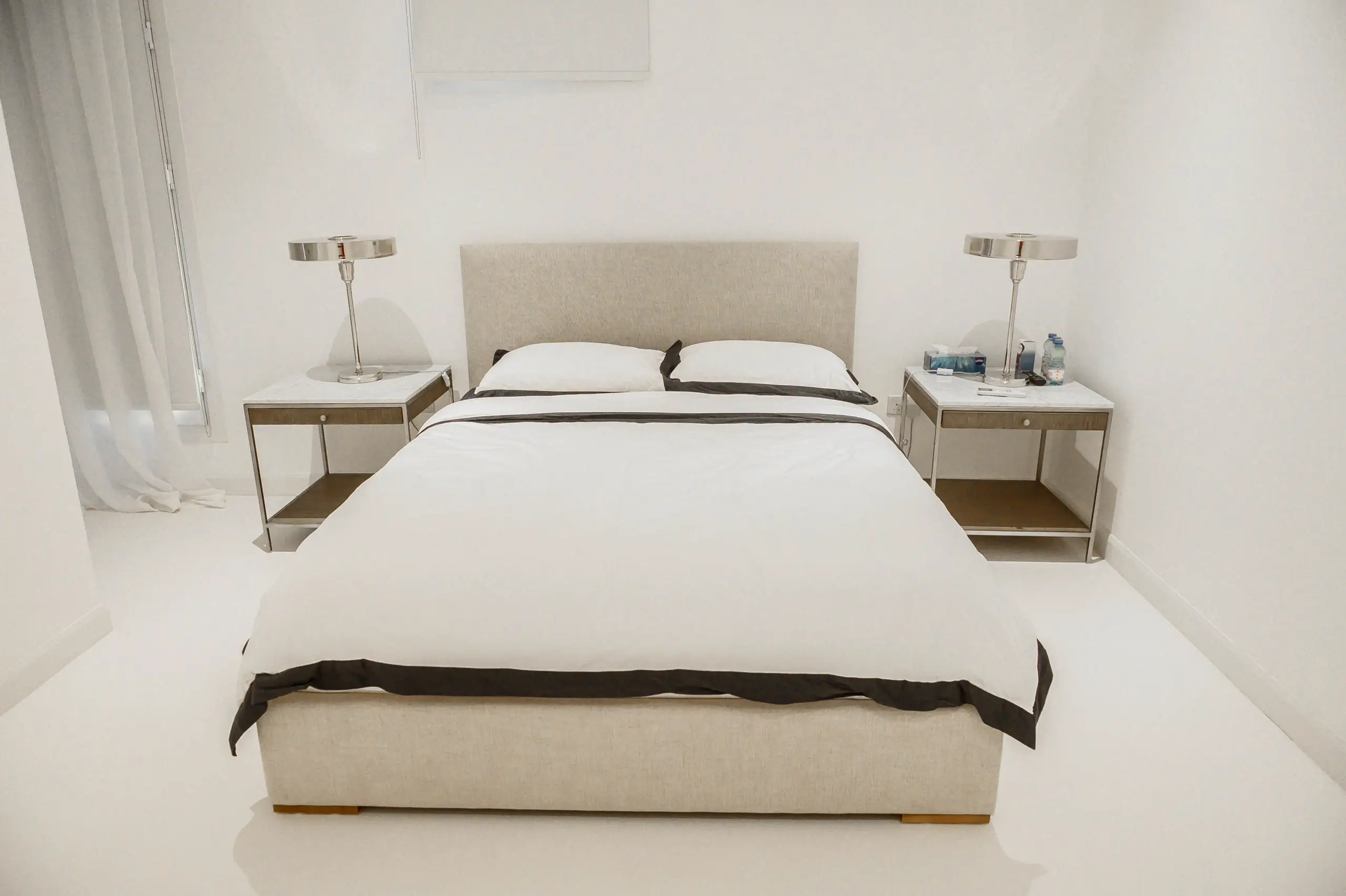 Minimalist bedroom with large bed and nightstands